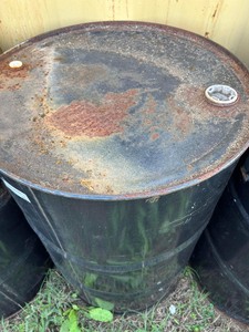 lot 264 image: Black 50 gallon barrel