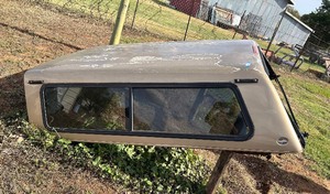 lot 88 image: truck camper shell, one window is busted out