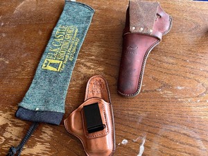 lot 255 image: holsters and a elk castle pistol sock