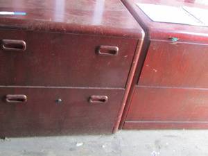lot 9 image: 2 wooden cabinets both have 2 lateral file drawers, used for filing or storage Qty 2