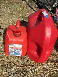 lot 75 image: 2 red gas cans used