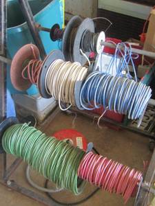 lot 116 image: metal rolly cart with various wire on it