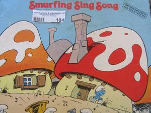 lot 104 image: record lot includes smurfing sing song, I want to hold you, a very merry Christmas