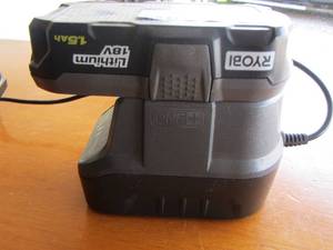 lot 218 image: ryobi battery and battery charger