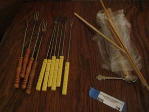 lot 39 image: Chop sticks- Fondue forks- white handled ones are clay bake