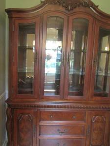 lot 5 image: LARGE HUTCH  Medium brown 2 pieces, 4 glass doors at top & 2 bottom doors and 2 drawers- Top 504819--- Bottom 324819