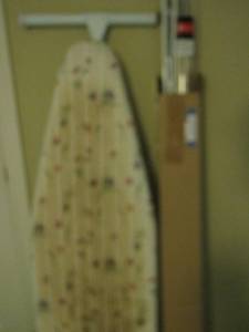 lot 72 image: Curtain rods- ironing board