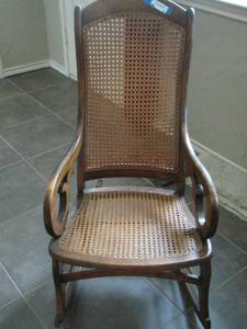 lot 26 image: Wooden wicker style rocking chair