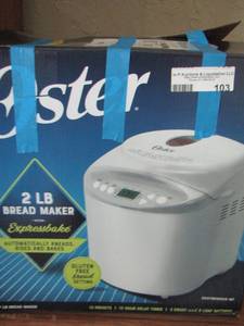 lot 103 image: Oster bread maker, new box has been opened never used