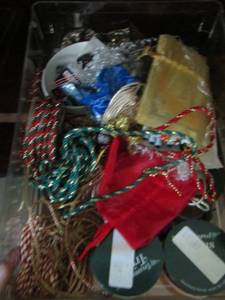 lot 109 image: small clear tub of ribbon holiday rope and more