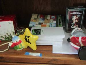 lot 133 image: Christmas lot includes mini lights qty 2 new, small clothes boxes, large clothes boxes new, new name tags, doorknob bell