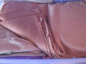 lot 160 image: Tub of cut and uncut clothfabric