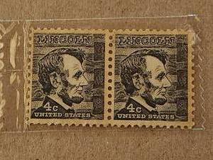 lot 92 image: Pair of vintage Lincoln 4 cent stamps