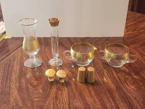 lot 111 image: Selection of gold trimmed glassware and gold colored salt and pepper shakers