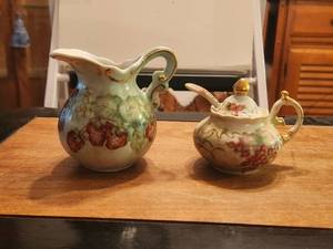lot 144 image: Vintage flower themed porcelain creamer and sygar bowl with spoon