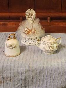 lot 272 image: Selection of 50th anniversary items - porcelain Lefton Bell and sugar bowl and cake topper