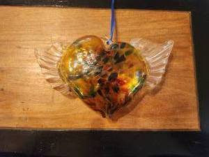lot 292 image: Hand blown glass heart with wings