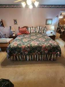 lot 386 image: King Size bed frame and headboard with free box springs and mattress - includes all bedding