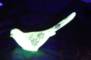 lot 1 image: Fenton Bird of Happiness, Hand painted and Signed Satin Custard Glass, Uranium Style Approximately 5T X 6 Long