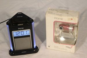lot 44 image: I home Alarm Clocks Docking Station and I home Notebook Webcam, Both in Original Packaging