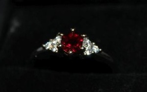 lot 21 image: Size 7 Ring with Simulated Ruby Stamped 925