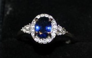 lot 22 image: Size 7 Ring with Simulated Saphire Stamped 925