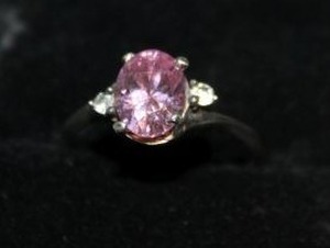 lot 25 image: Size 7 Ring with Simulated Pink Topaz and Simulated Diamond Accent Stones Stamped 925