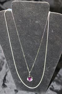 lot 68 image: Silver Necklaces 20 with a Pear Shaped Simulated Amethyst and Simulated Diamond Accents, 26 Silver Necklace Both Stamped 925, Pendant is not stamped