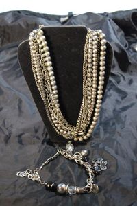 lot 81 image: Charm Bracelet and Multi Strand necklace