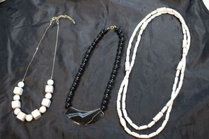 lot 100 image: White and Black Necklaces