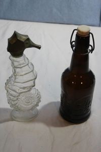 lot 118 image: Vintage Avon Seahorse Bottle and Rare Vintage Bottle- Creek Honey