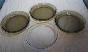 lot 154 image: Four (4) Anchor Hocking 9 Pie Pans, Three (3) are Smoky and One (1) Clear