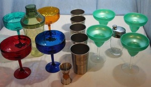 lot 168 image: Cocktail Making Supplies, Including a Plastic Shaker, Glass Shaker with Strainer Lid, Metal Tumblers, and a Metal Jigger