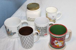 lot 174 image: Polar Express Mug, Coffee Canister, and Fitz and Floyd Coffee Cup and More