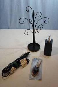 lot 211 image: Vidal Sasoon Curling Brush, Hair Brush, Pump Dispenser and Necklace Display