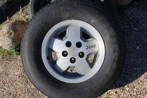 lot 256 image: One (1) Jeep Rim 15 Tire, LT23575 R15