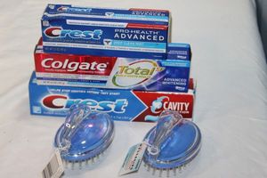 lot 289 image: Three (3) Unopend Tubes o fToothpaste (See Photos for Brands) Two (2) Unused Scalp Massagers