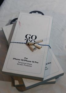 lot 335 image: Unused Tempered Glass Screen Protectors for Iphone 13 and 13pro with Headphone adapters