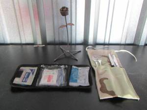 lot 48 image: Camo clip on first aid kit, travel size silverware, metal rose dcor