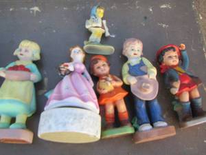 lot 67 image: Boy and girl ceramic figurines