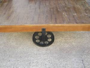 lot 3 image: Wooden coffee table with very unique feet, wagon wheel look