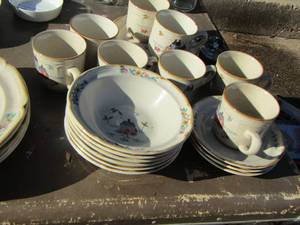 lot 78 image: International stoneware dish set includes- 8 coffee cups- 3 cup saucers- 6 bowls-2 saucers- 4 dinner plates