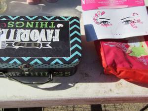 lot 92 image: New in pack team hope face decal, small tinker bell hand bag, box of colorful hair extensions