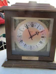 lot 16 image: Bulova table top clock, minor damage