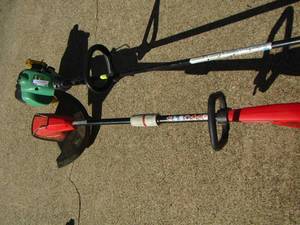 lot 32 image: Homelite weed eater , feather lite weed eater, both used unknown working condition