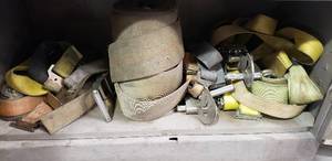 lot 289 image: Contents of Shelf, Large lot of Heavy Duty Ratchet Straps & Tow Straps