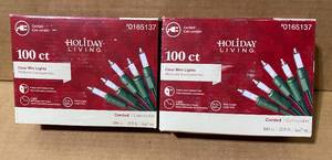 lot 113 image: Lot of 2 - New Holiday Living 100ct Corded 21.9 Clear Mini Lights, Model#0165137 - In Condition As Shown