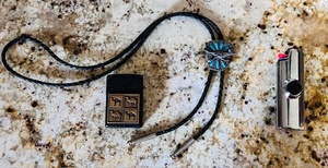 lot 73 image: Vintage Turquoise Roadrunner Bolo Tie, Camel Zippo Lighter, &amp Crome Cigarette Lighter Case