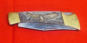 lot 56 image: American International Mint American Eagle Folding Pocket Knife