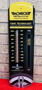 lot 55 image: Monroe OESpectrum Shocks &amp Struts Metal Wall Hanging Themometer